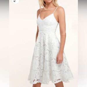 Lulu’s sleeveless lace midi dress with pockets